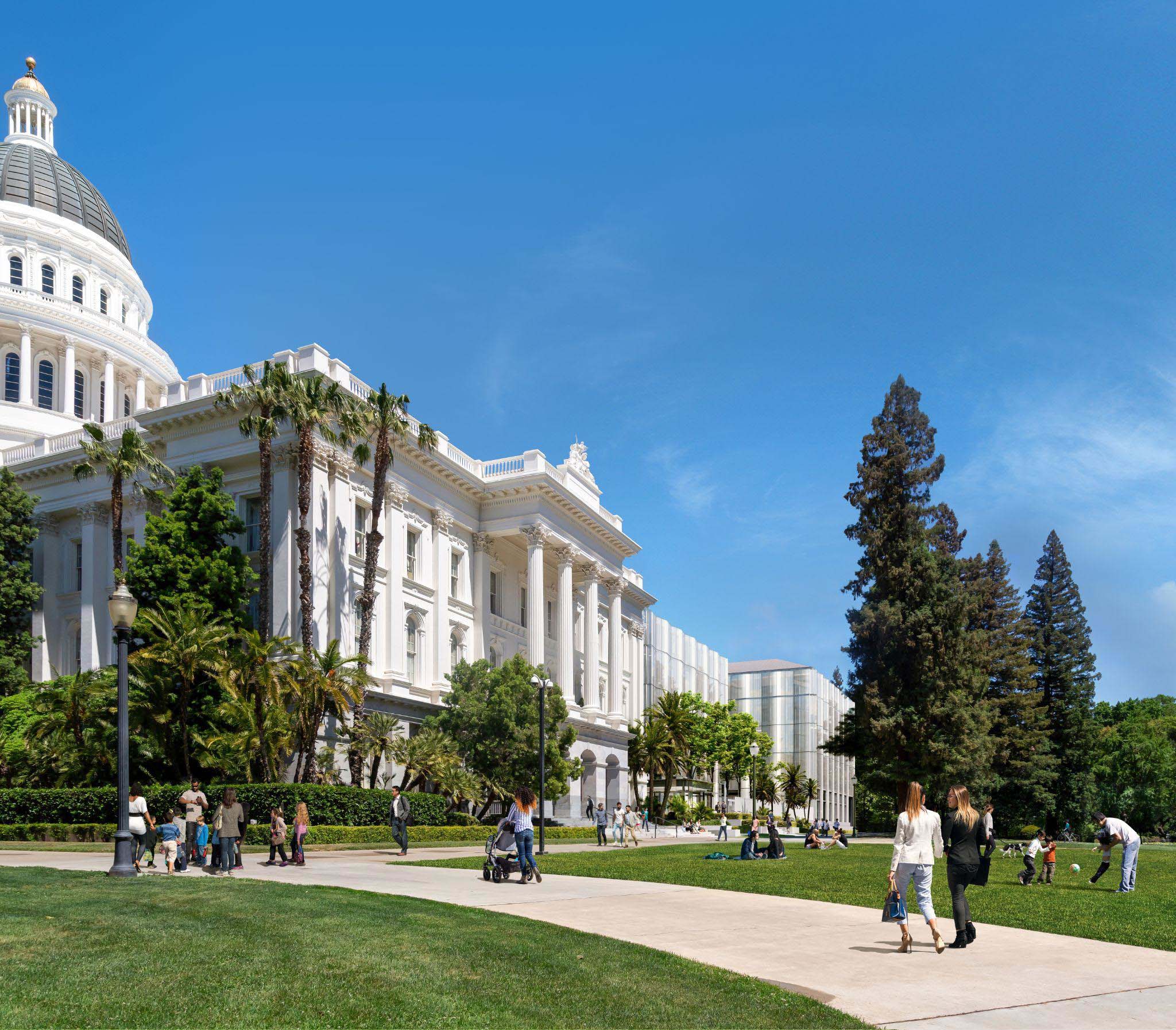 Architectural rendering of the new Annex building viewed from the park plaza, with the historic Capitol dome visible in the background.