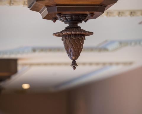 Photo of carved pineapple symbolizing hospitality throughout the staircases